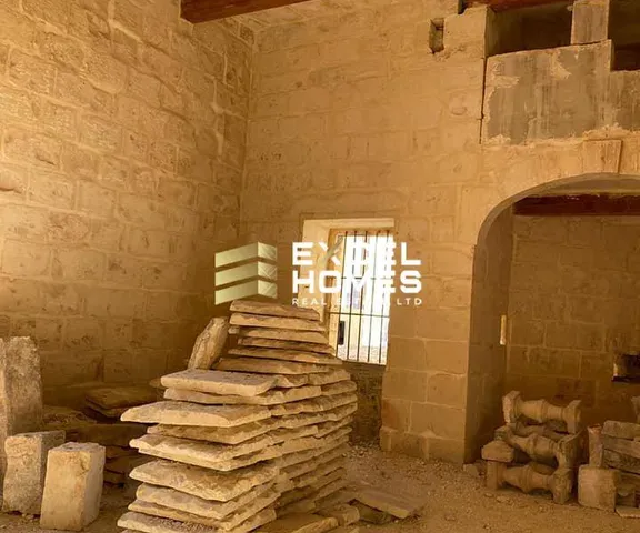 a brick wall with a pile of bricks on top of it