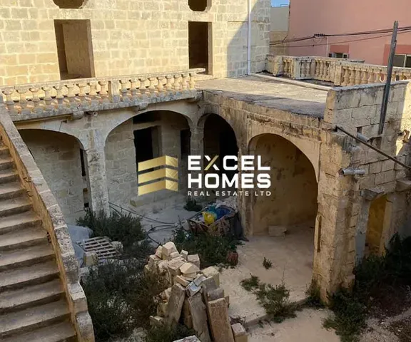 a building with a large window and a clock