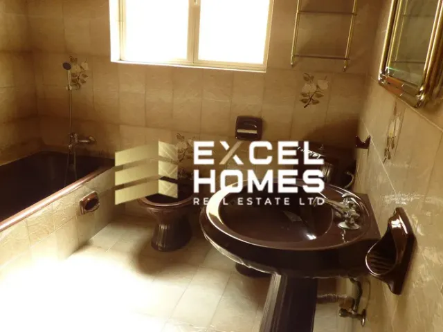 a bathroom with a toilet and a sink