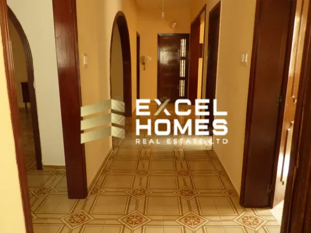 a hallway with a door leading to a room with a door