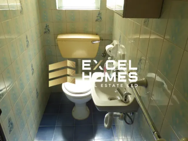 a bathroom with a toilet and a sink