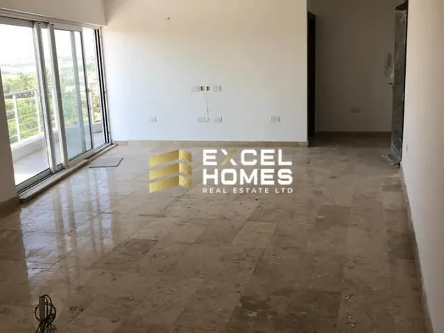 a bathroom with a white floor and a white wall