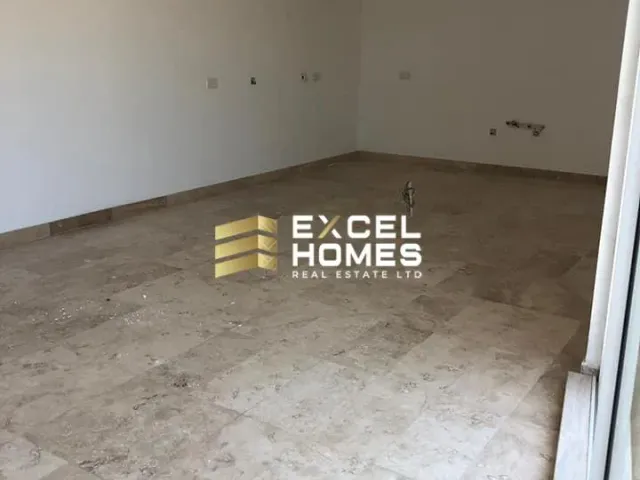 a wall with a broken down mattress and a broken down chair