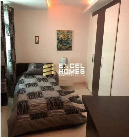 a bed room with a bed and a desk 