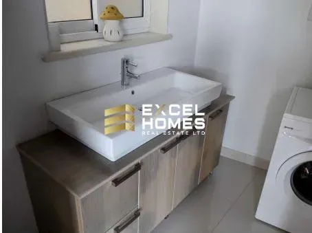 a sink and a toilet in a small room 