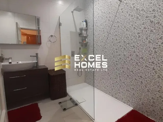 a bathroom with a sink, mirror, and a toilet