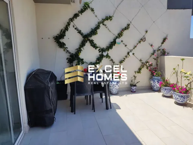 a table with a table cloth and chairs