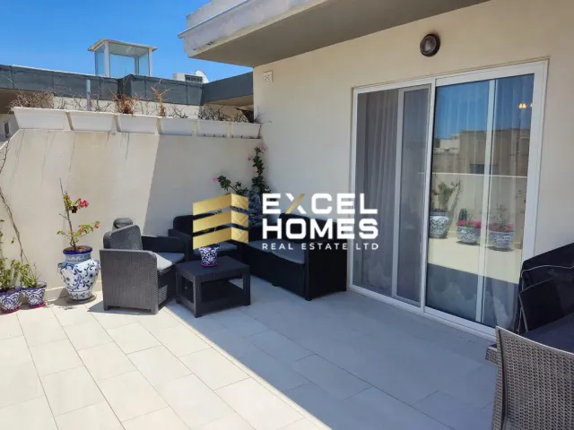 a room with a couch and a table with chairs