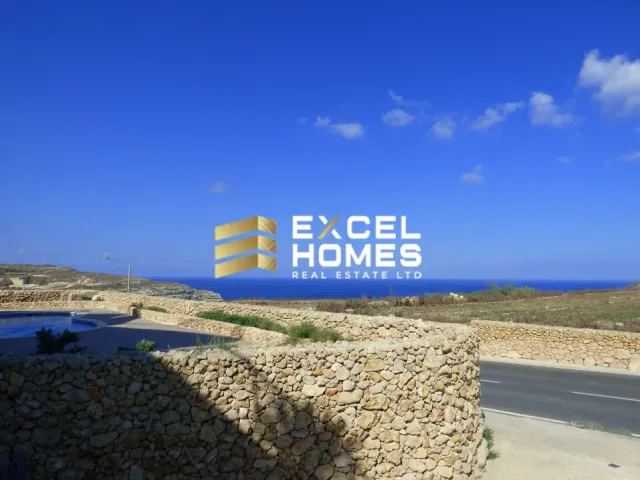 a blue sign on a blue beach