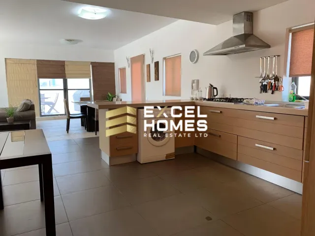 a kitchen with a sink, stove, and a refrigerator 