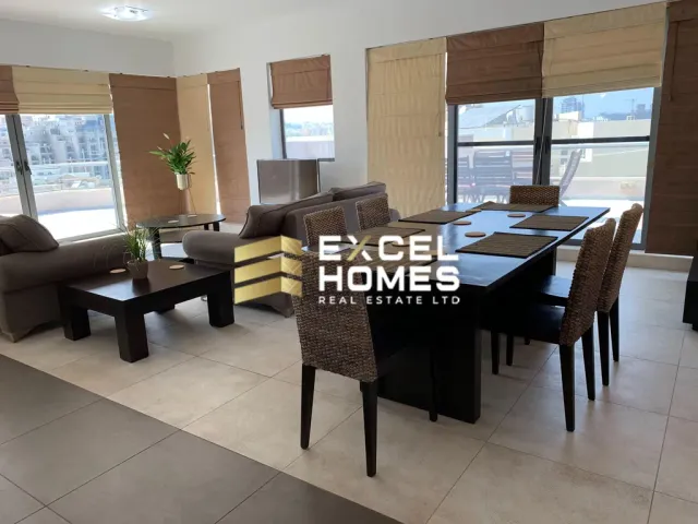 a living room with a couch, chairs, tables and a table with a glass table 