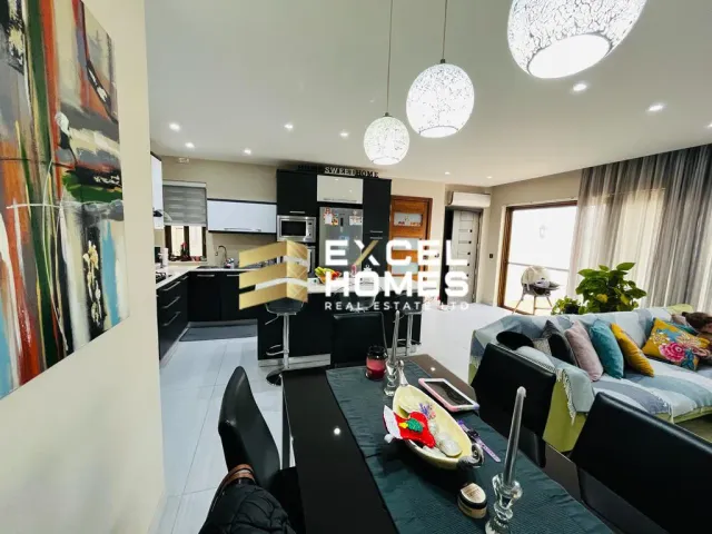 a living room with a large clock on the wall