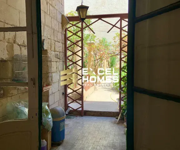 a small room with a window and a window