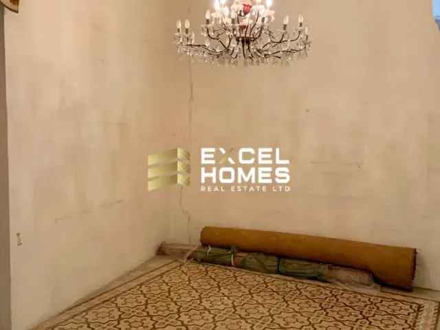 a room with a rug and a lamp