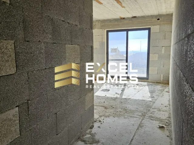 a wall with a door and a building