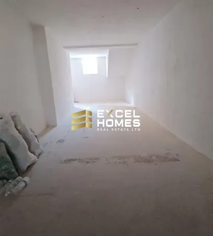 a room with a wall with a wall of bricks and a wall of a white wall