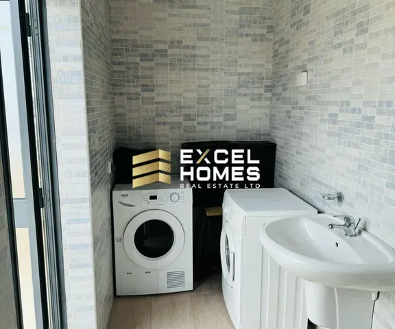 a bathroom with a sink, toilet and a window