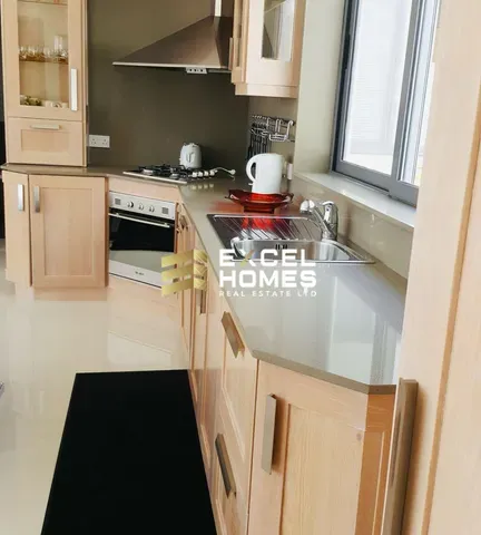 a kitchen with a stove, microwave, and refrigerator