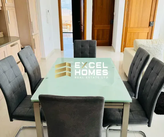 a table with chairs and a table cloth