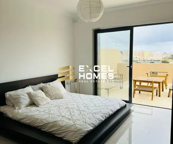 a bed with a white bedspread and a white bedspread