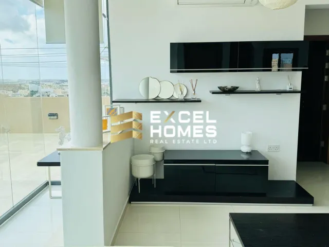 a white kitchen with a white refrigerator and a white sink