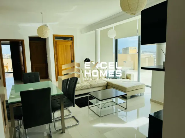 a kitchen with a table and chairs and a large window