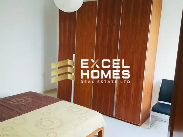 a bed with a wooden headboard and a wooden door