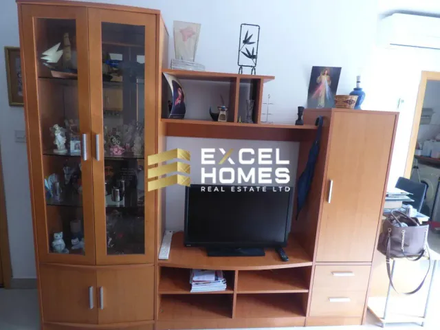 a television set sitting on top of a wooden stand