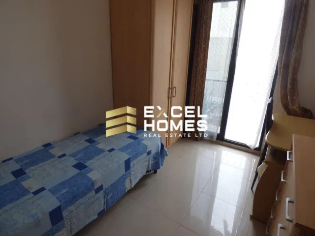 a bed in a room with a window