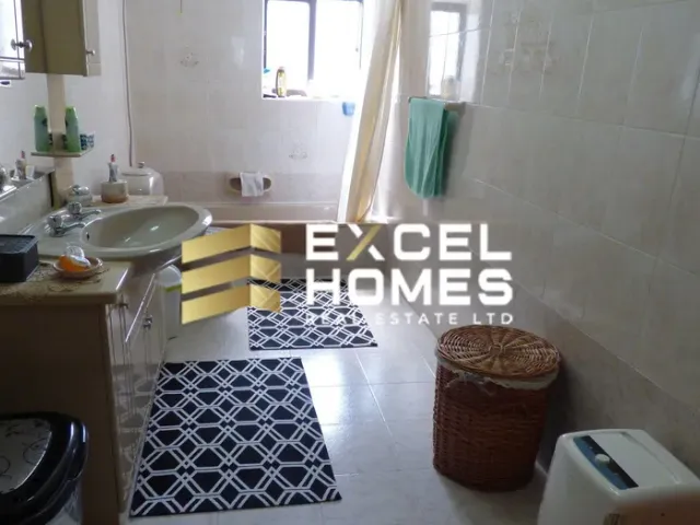 a bathroom with a toilet and a sink