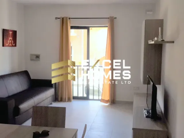 a living room with a couch and a tv