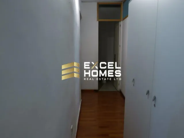 a door is open to a room with a white wall