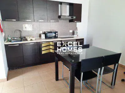 a kitchen with a table and a sink 