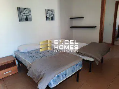 a bed room with a bed and a desk 