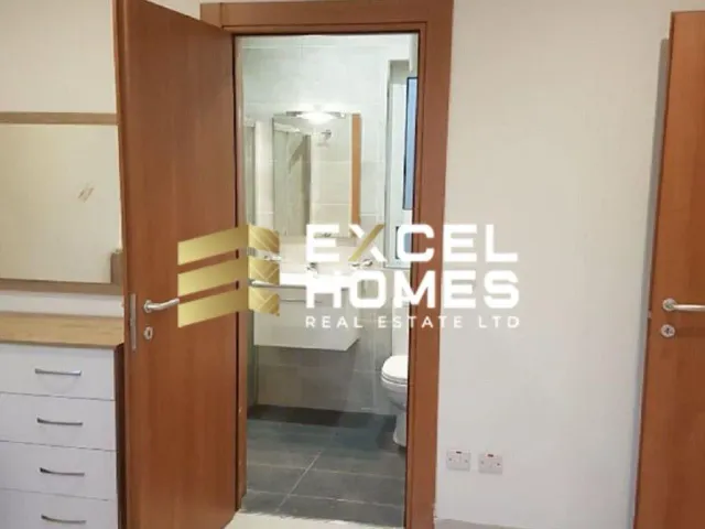 a door leading to a bathroom with a mirror