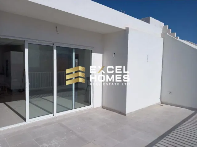 a white wall with a bunch of bananas hanging from it