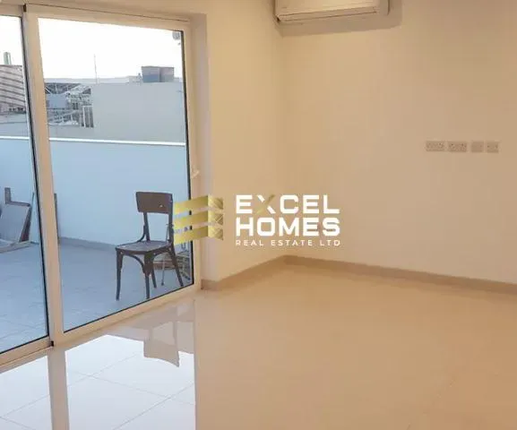 a room with a chair and a window