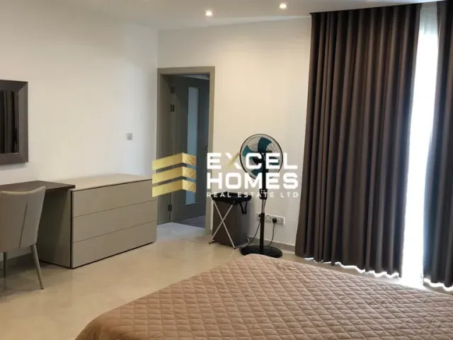 a room with a large mirror and a bed 
