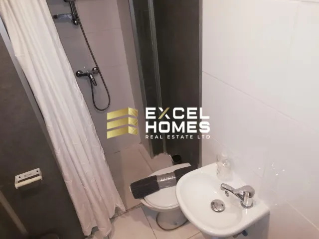 a bathroom with a toilet and a sink 