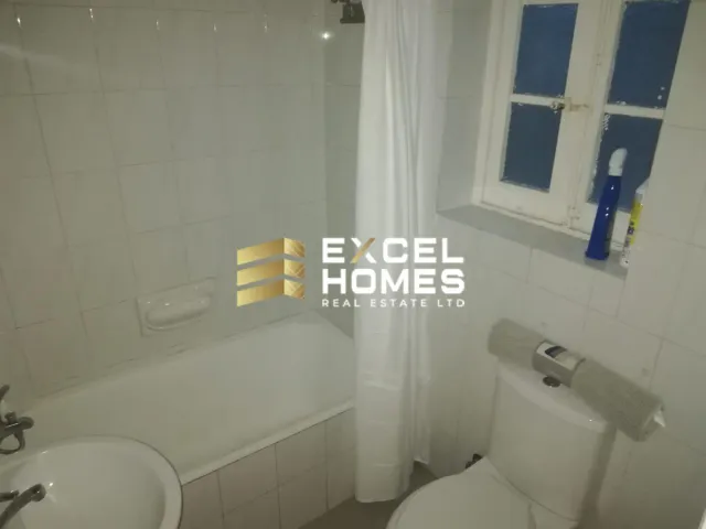 a bathroom with a toilet and a bathtub 