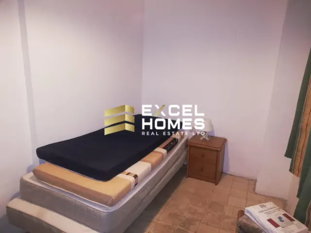 a bed with a white bedspread and a black and white bedspread 