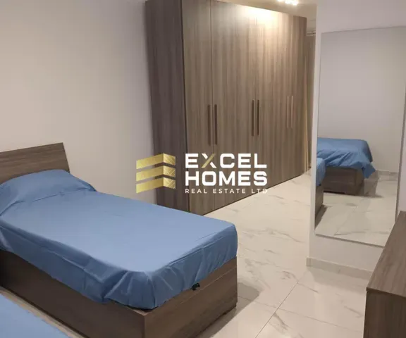 a bed room with a bed and a desk