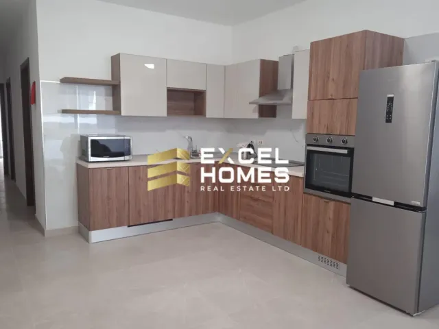 a kitchen with a refrigerator, stove, microwave and a sink