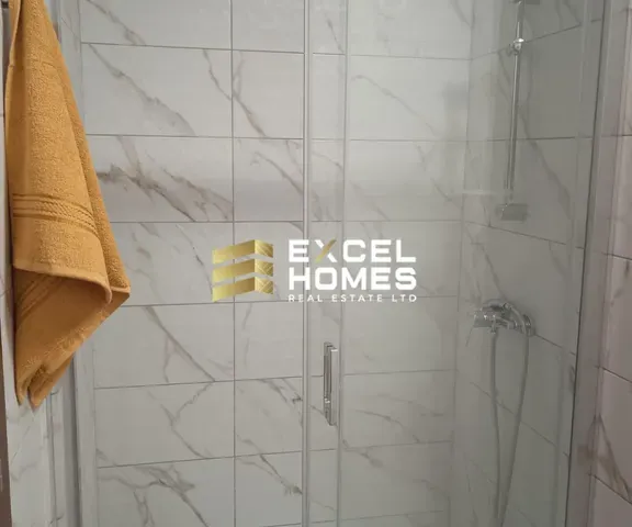 a shower curtain is hanging on a wall