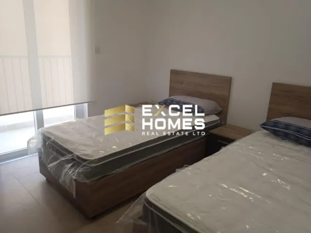 a bed with a blanket and a pillow on it