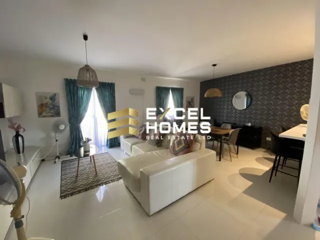 a living room with a large window and a large bed