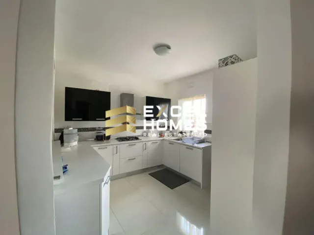 a white sink and a white counter top in a room