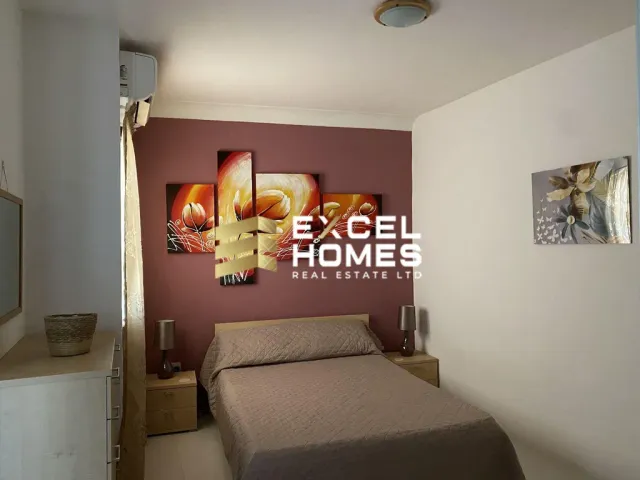 a bed room with a bed and a dresser