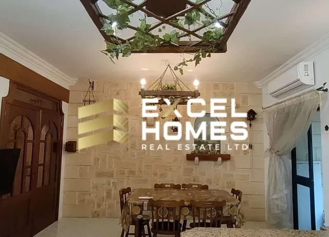 a dining room table with a large clock on it