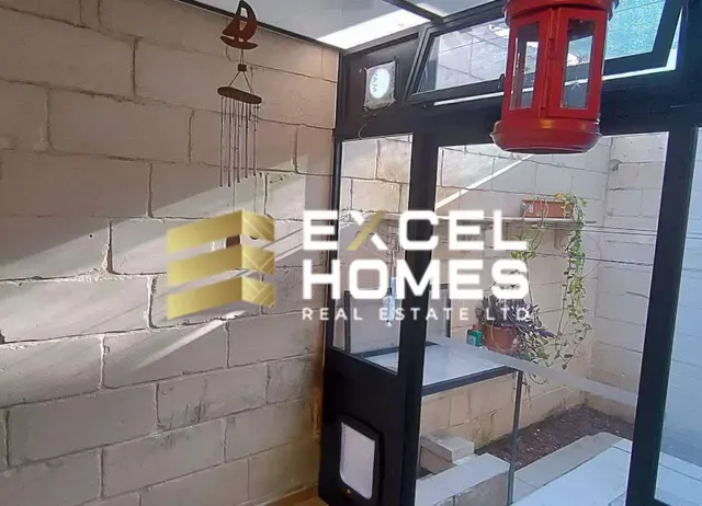 a sign on a wall with a light on